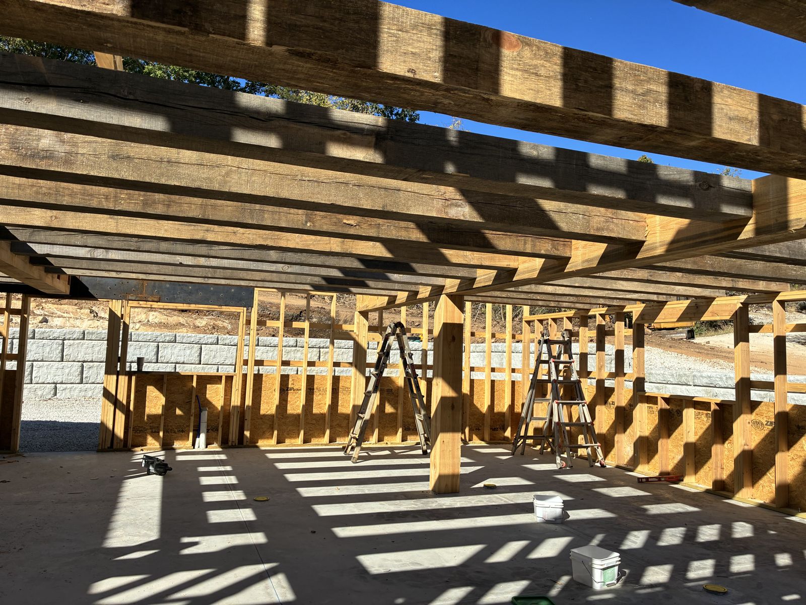 Heavy timber beams over framed walls