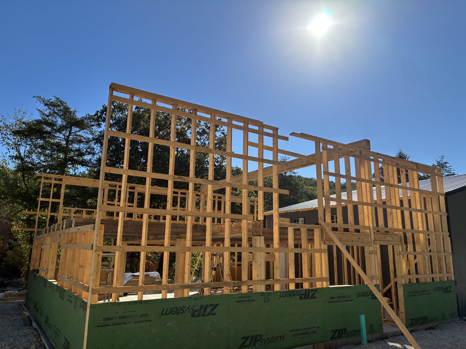 Framed walls with sun overhead